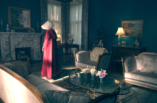 The handmaid stood in the lounge