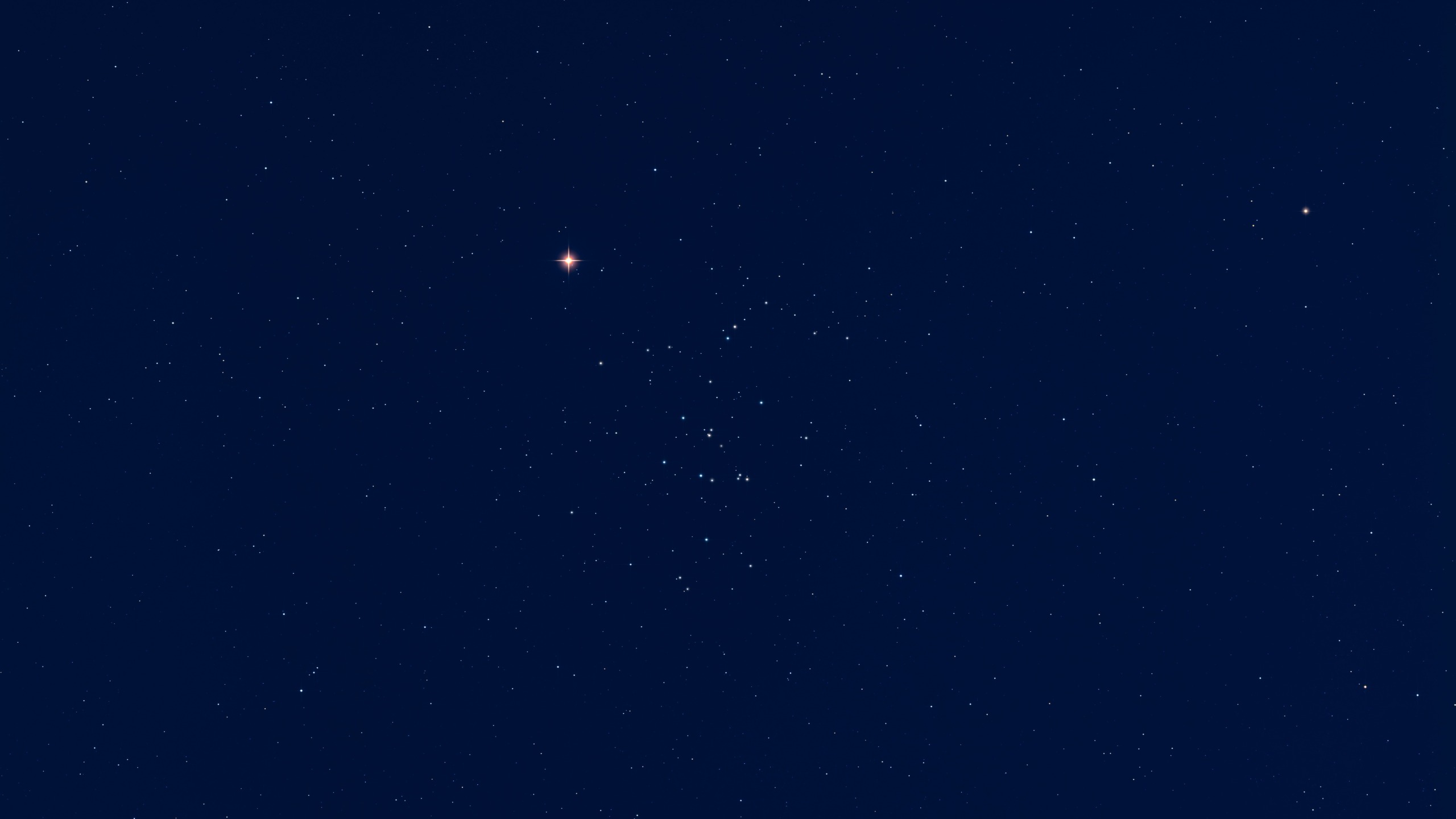 mars glows red next to a cluster of stars, the beehive cluster.