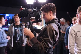 Student operates video camera