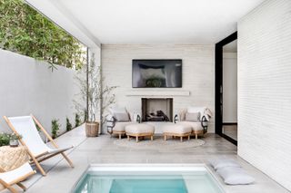 A small backyard with a tiny plunge pool