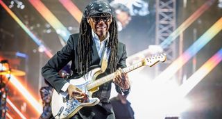 Nile Rodgers plays his Hitmaker Stratocaster onstage at OverOslo 2025. He wears a black bandana.