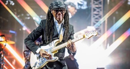 Nile Rodgers plays his Hitmaker Stratocaster onstage at OverOslo 2025. He wears a black bandana.