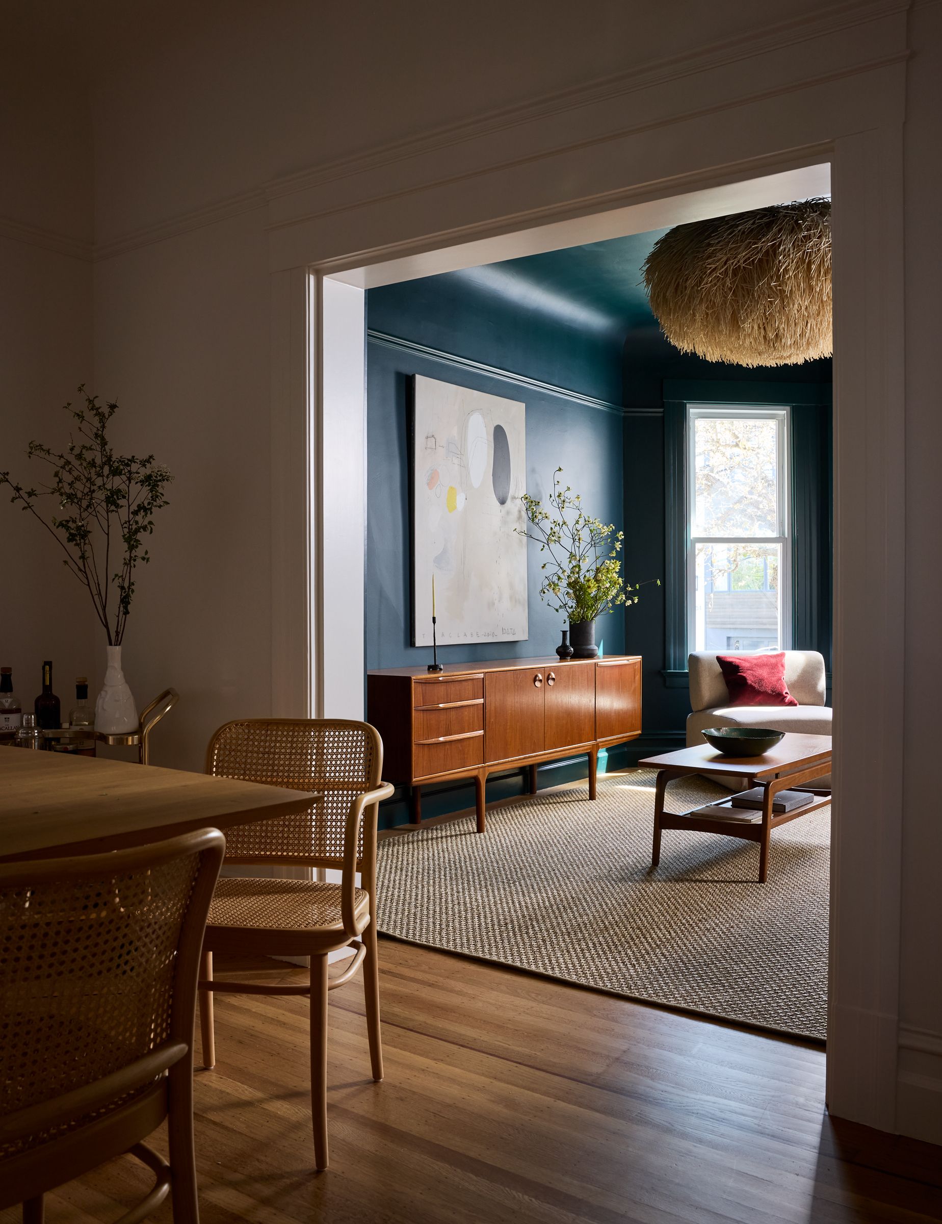 A broken plan dining living room where layers of materials and textures fill the space 