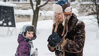woman and child in snow