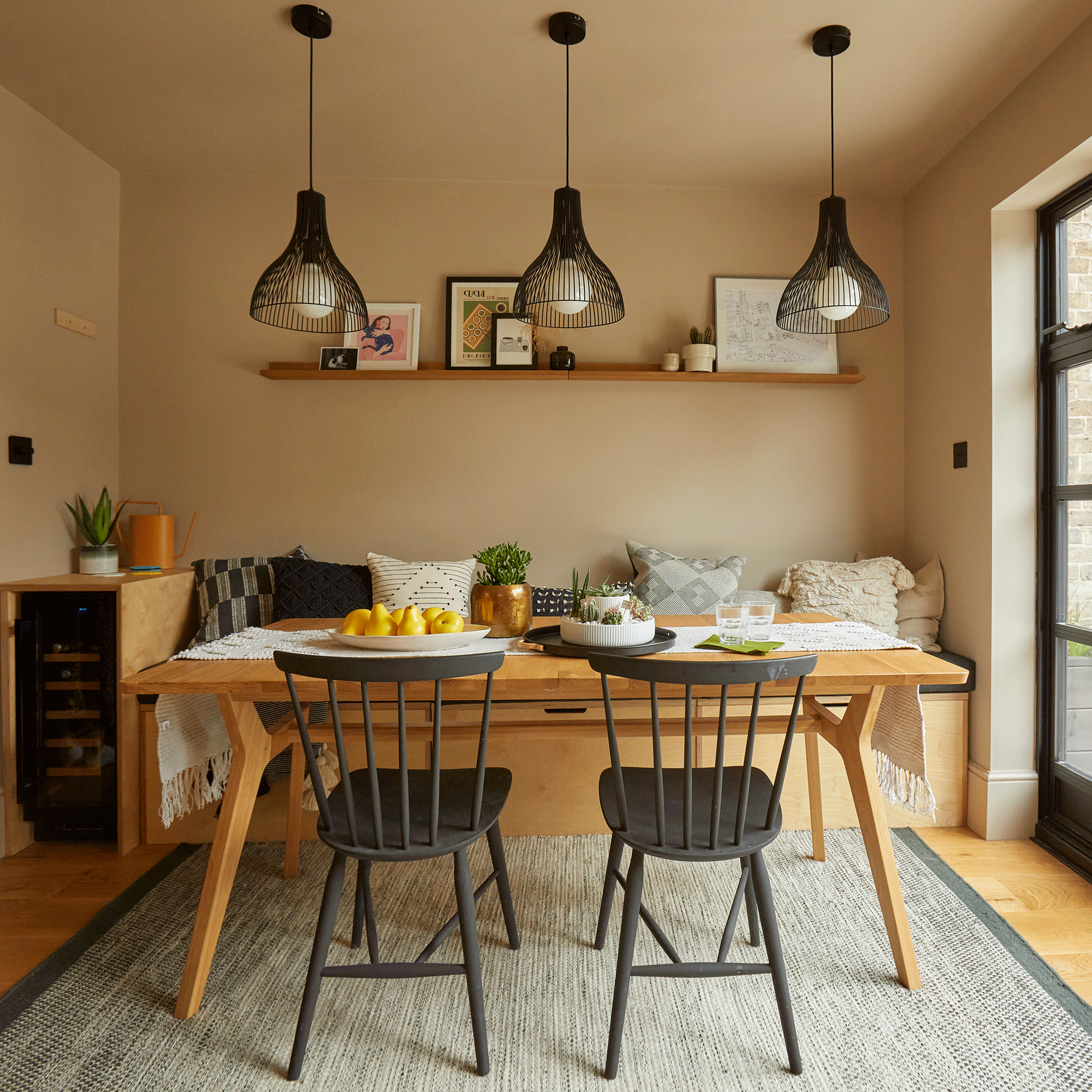 Terracotta dining room with wooden table