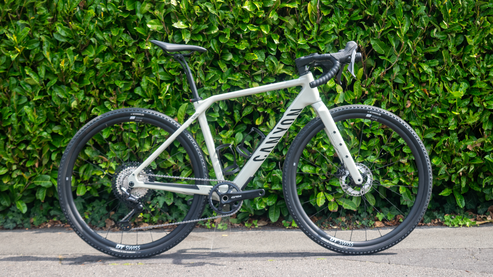 Canyon Grizl ESC w/ ECLIPS pictured against a hedge