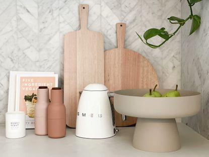 Smeg kettle in kitchen with wooden chopping boards