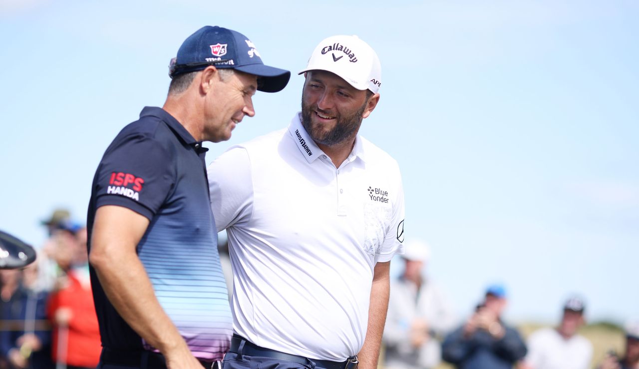 Padraig Harrington and Jon Rahm chat walking down the fairway at The 150th Open Championship