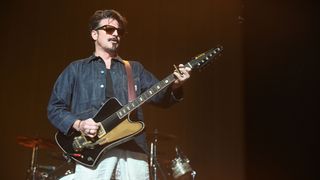 Scott Holiday of Rival Sons plays a Firebird-style Krauer guitar onstage.