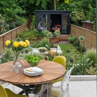 garden area with dining table and plants