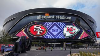 Video board displaying logos for Super Bowl LVIII, Kansas City Chiefs and the San Francisco 49ers at Allegiant Stadium