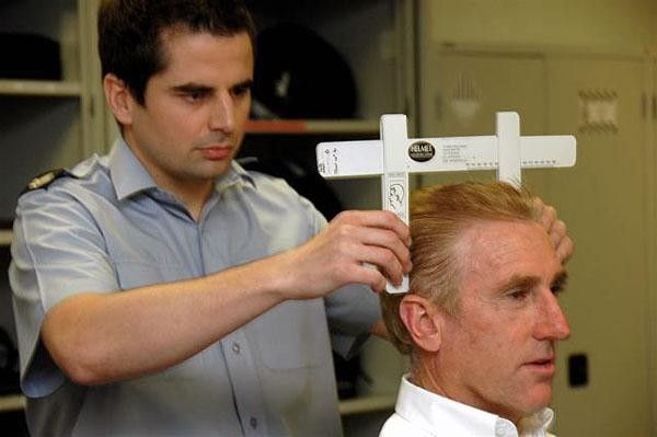 Sean Kelly getting his head measured for his new helmet.