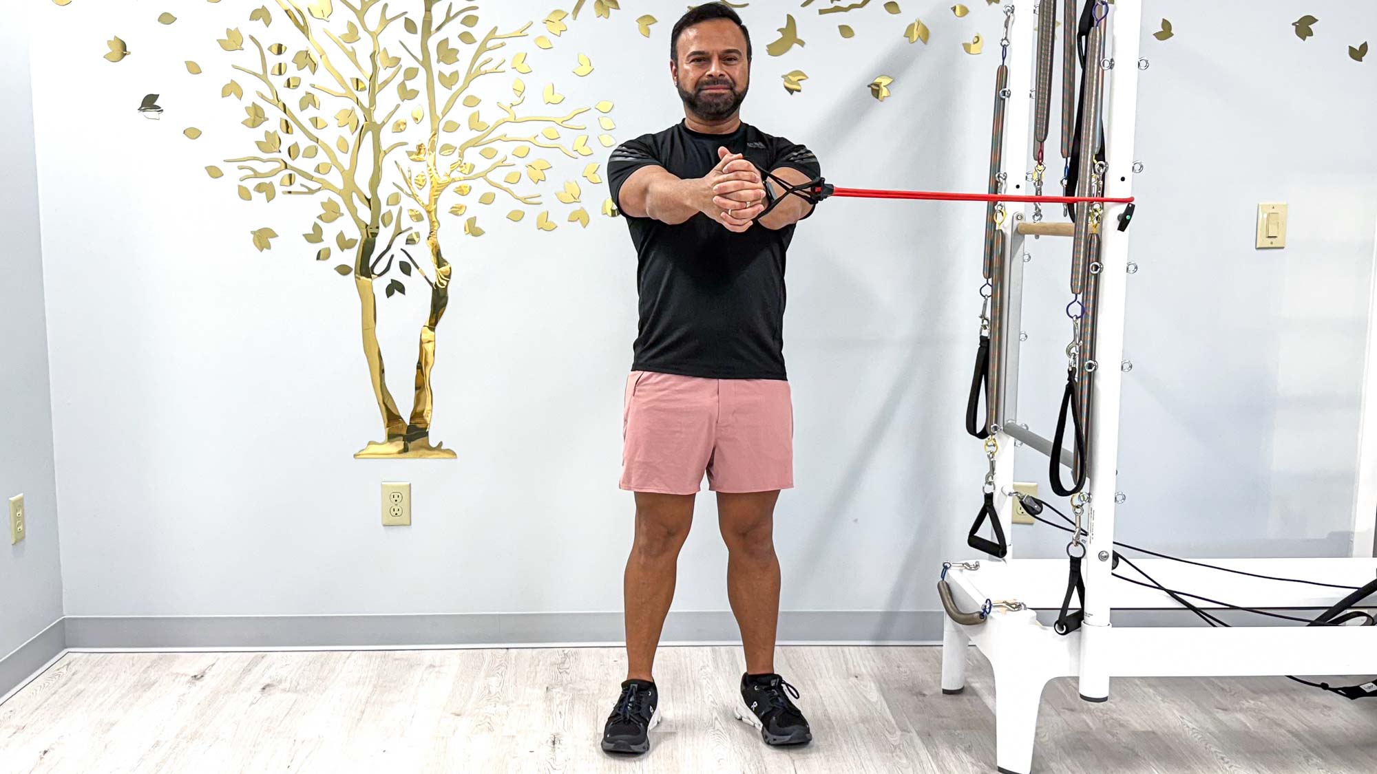 Nico Gonzalez holding a resistance band