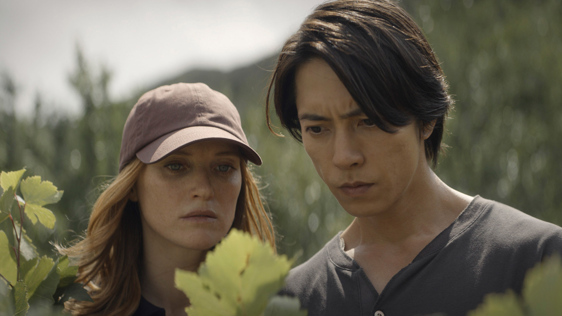 Fleur Geffrier and Tomohisa Yamashita look at a vineyard in Drops of God season 2