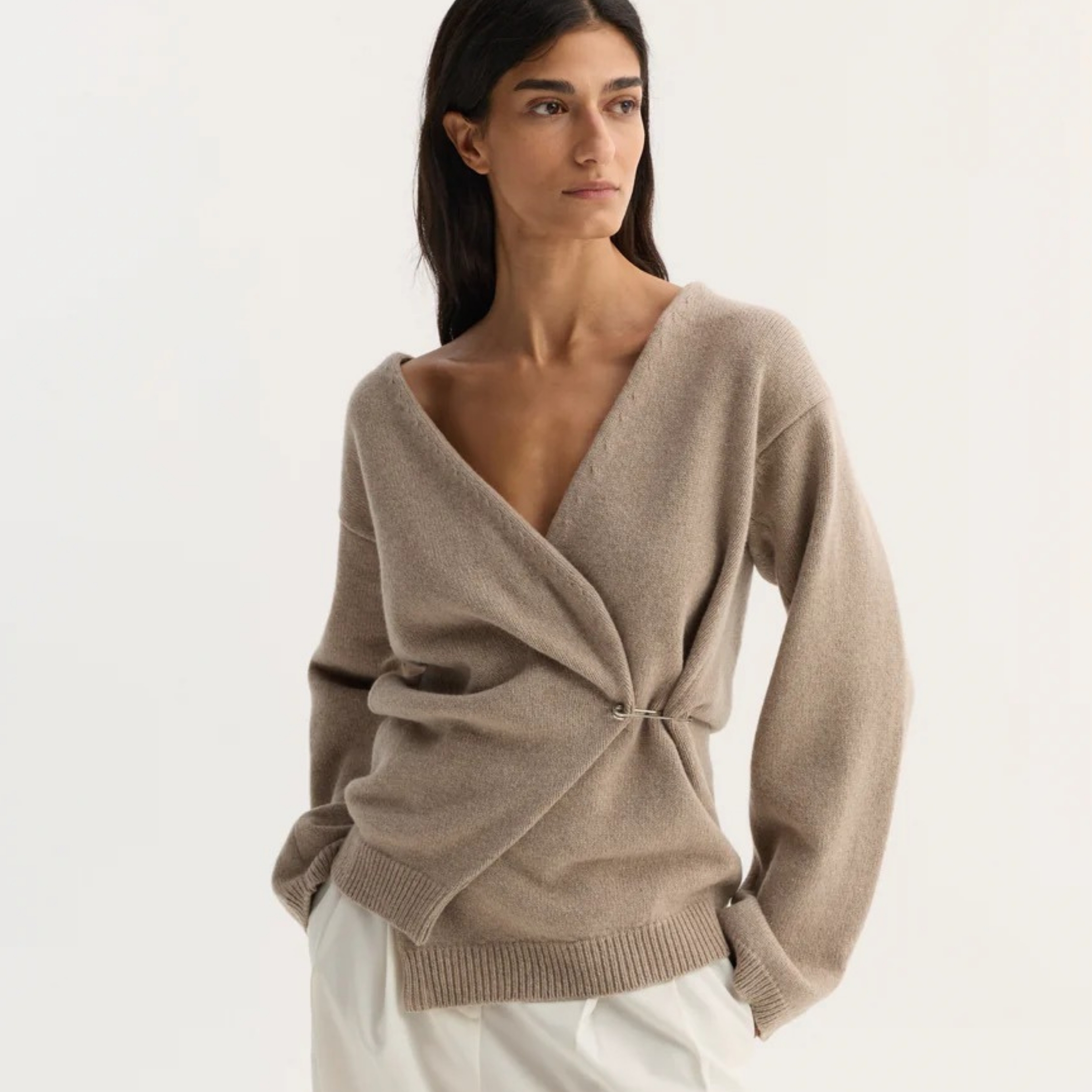 A model wearing a cream jumper from R&oacute;he.