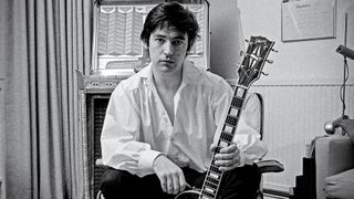 Chris Spedding, British rock and roll and jazz guitarist, posing with his guitar at home in Wimbledon, London, England, Great Britain, 1978. 