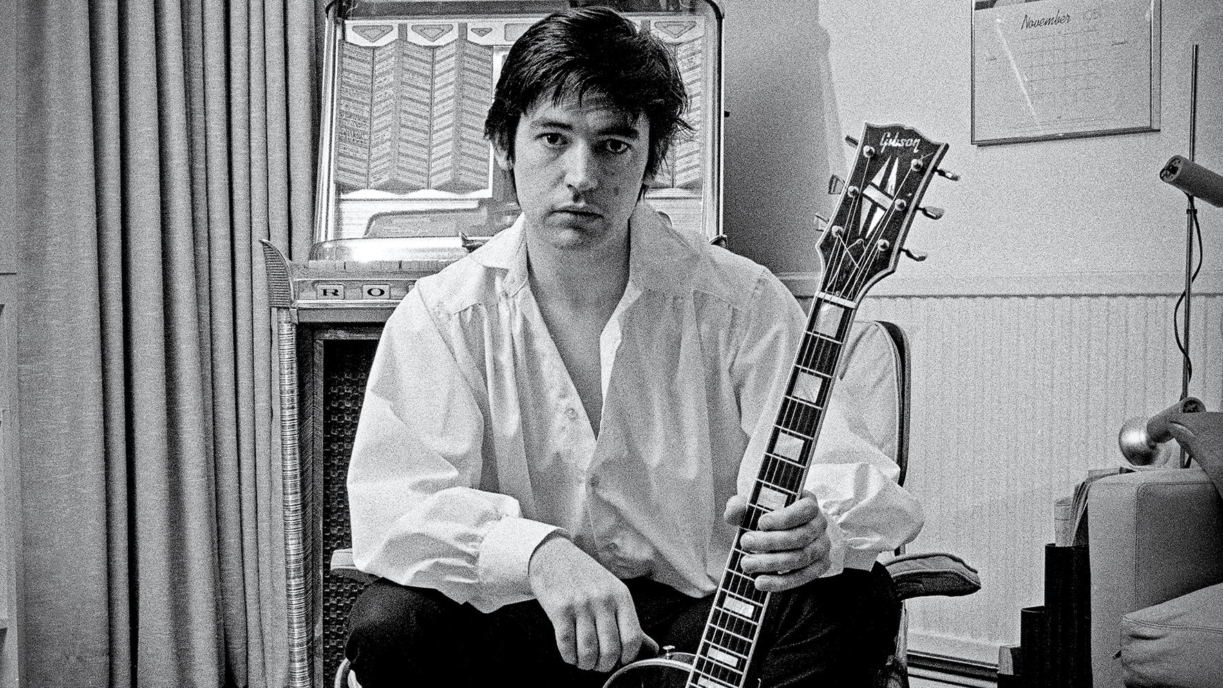 Chris Spedding, British rock and roll and jazz guitarist, posing with his guitar at home in Wimbledon, London, England, Great Britain, 1978. 