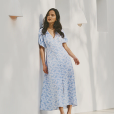 Model wearing a blue nobody's child dress