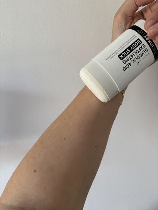 Mica Ricketts holding The Inkey List Glycolic Acid Exfoliating Body Stick