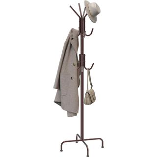 A bronze coat rack with a coat, bag and hat