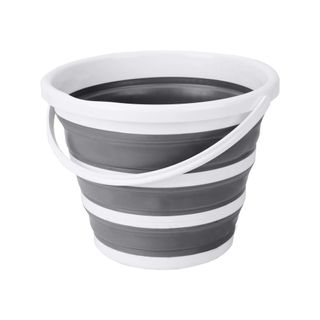 A gray and white striped collapsible bucket with a white handle