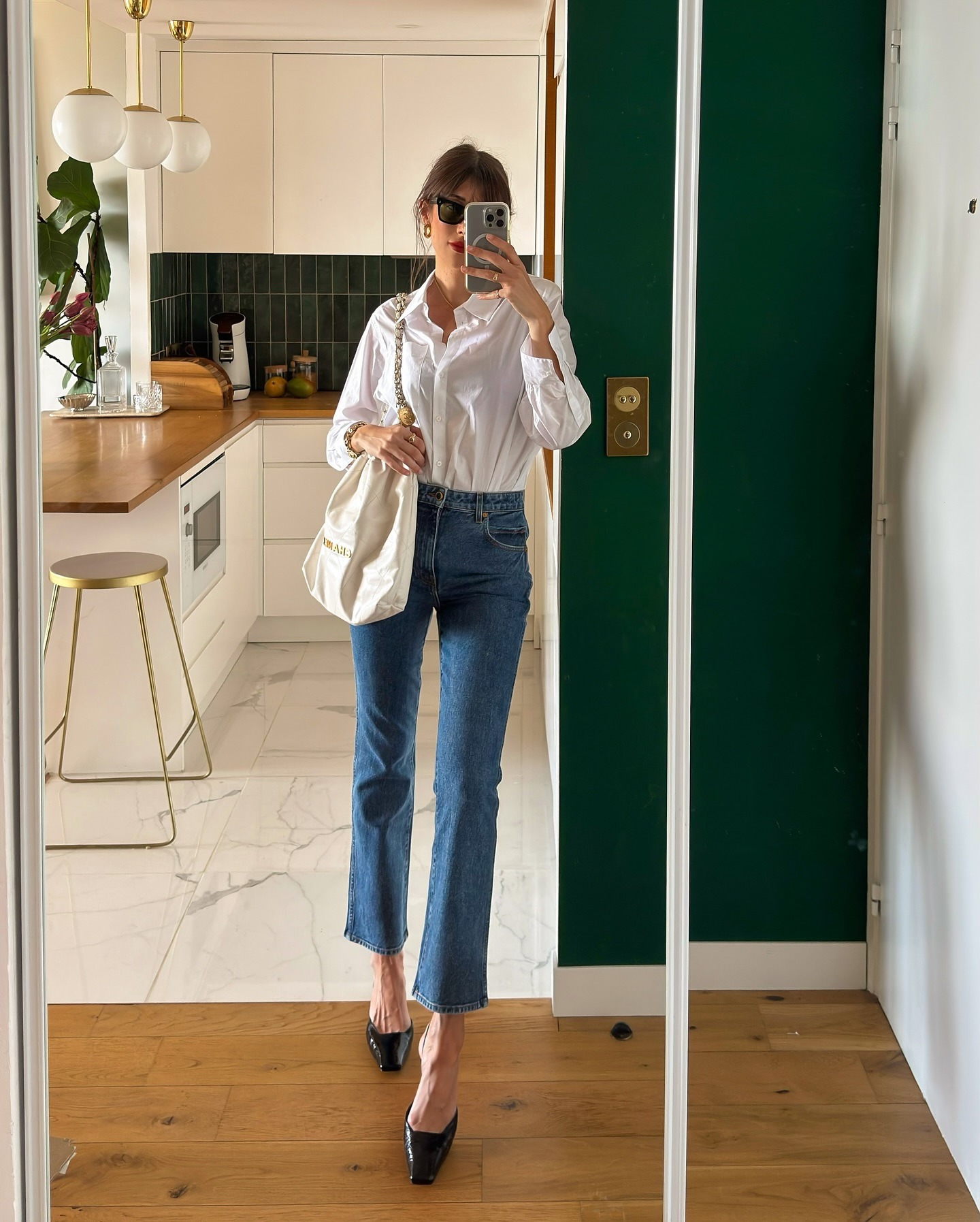 French influencer wearing cropped flares and kitten-heel pumps