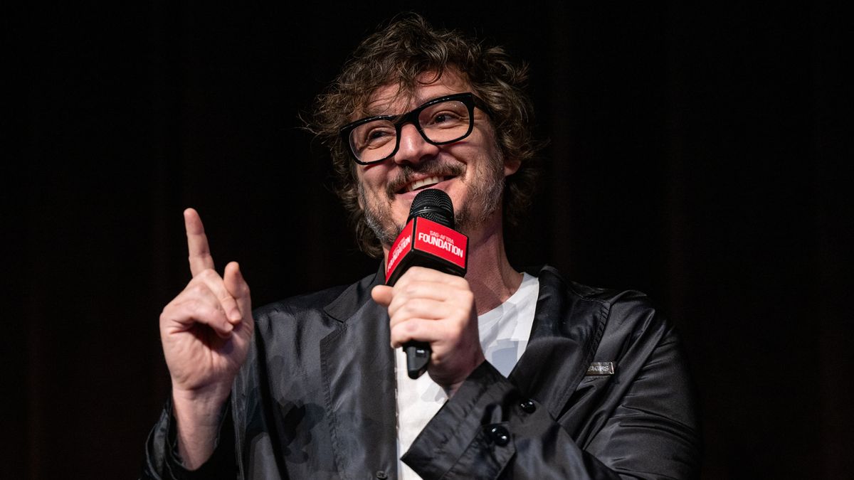 Pedro Pascal speaks to a packed SAG-AFTRA Foundation audience with a mic close to his face