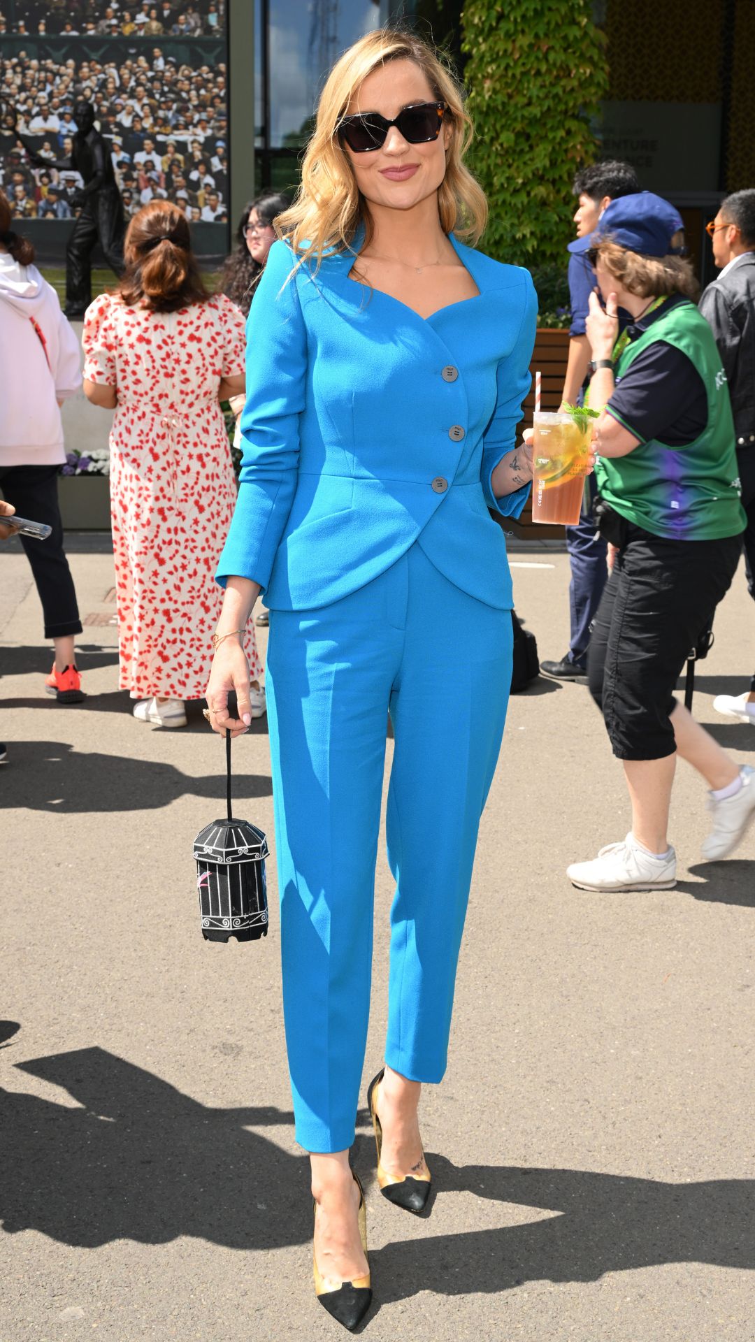 laura whitmore wearing a blue suit