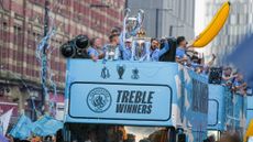 Manchester City players celebrated the treble with a bus parade 