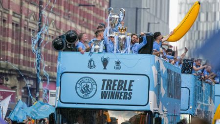 Manchester City players celebrated the treble with a bus parade 