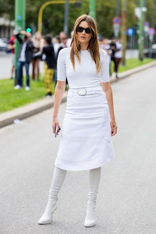 A woman dressed in all white