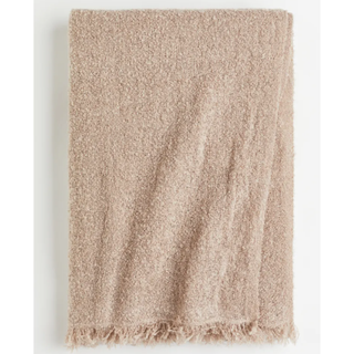 beige boucle throw blanket with fringing
