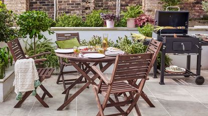 a garden table and charcoal grill