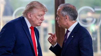 US President Donald Trump speaks with Canada's Prime Minister Mark Carney during a work lunch as part of the G7 summit, in Evian, eastern France, on June 16, 2026.