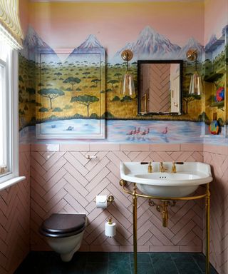 Pink tile bathroom, desert mountain mural