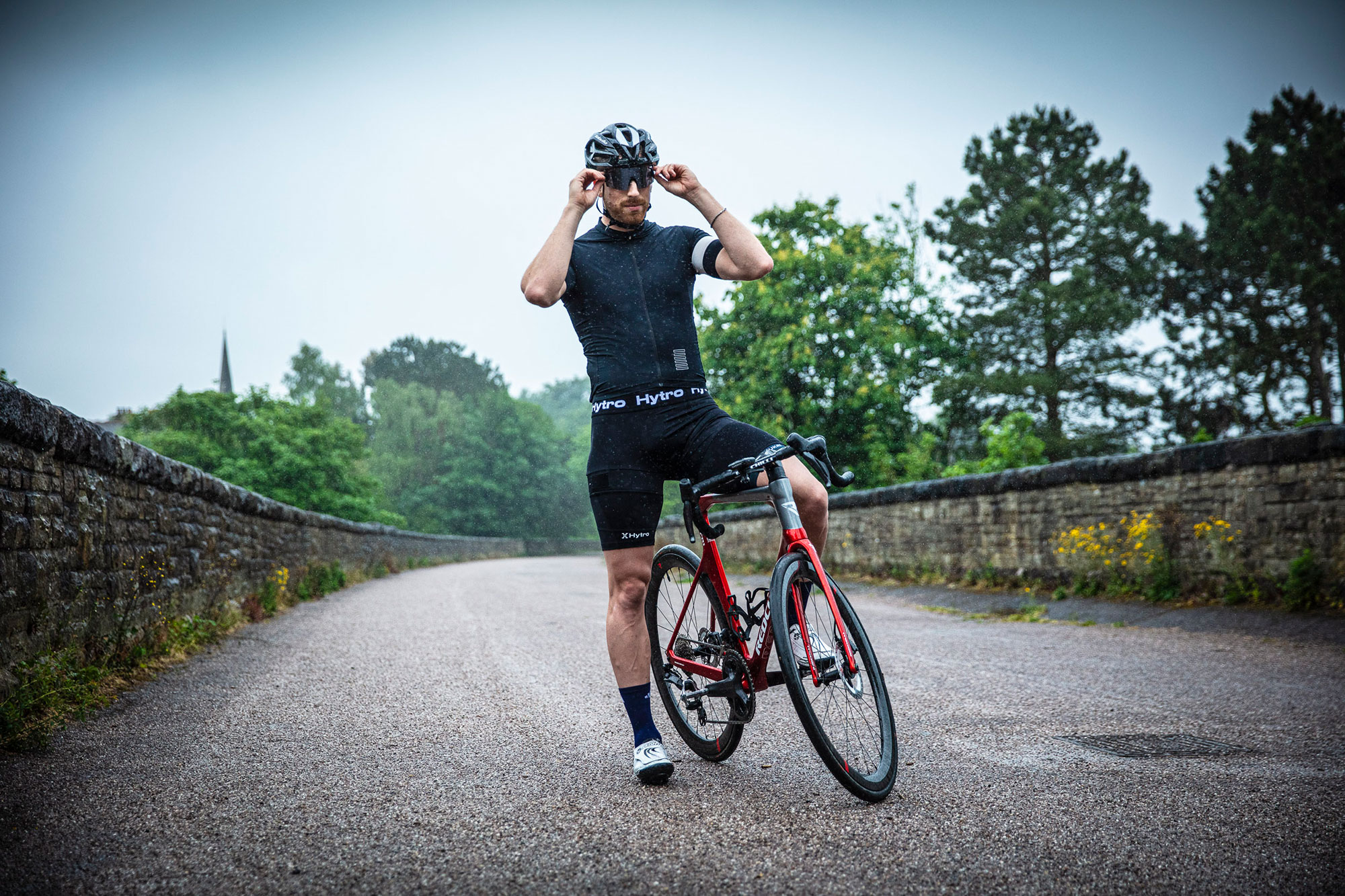 Joe Truman, astride bike in the rain, wearing Hytro shorts