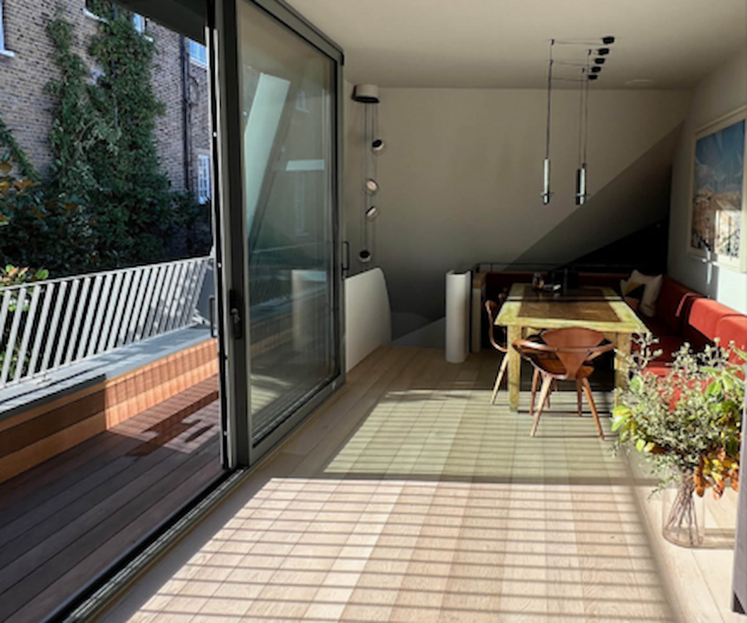 A rooftop terrace extension with a dining area