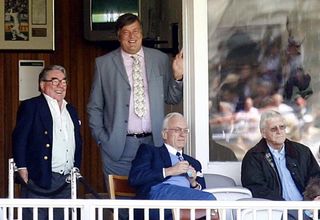 Stephen Fry and Michael Parkinson watch a Test match