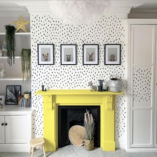 room with yellow fireplace and cupboard and storage shelves