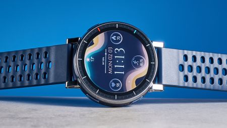 the amazfit active 3 premium photographed against the blue tom's guide background