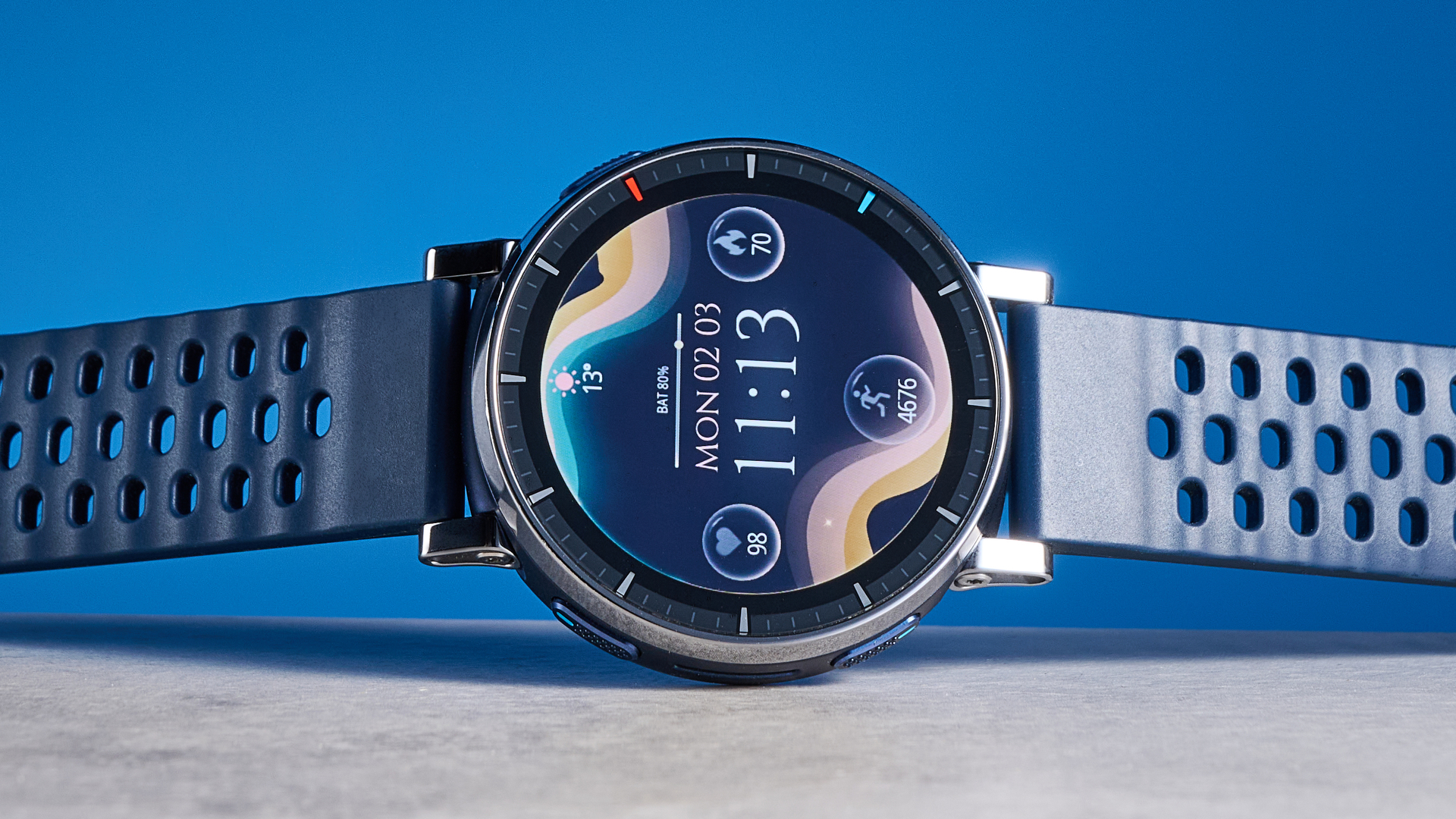 the amazfit active 3 premium photographed against the blue tom's guide background