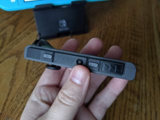 How to pair Joy-Cons Nintendo Switch Lite: Tilt the Joy-Con to the side to see the black button next to four LEDs, push the black button for three seconds or until the controllers pair to the Switch Lite
