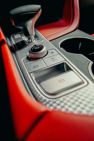 Genesis G70 car, interior detail image showing gear shift and controls