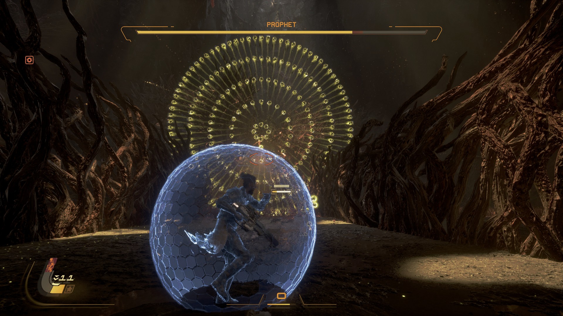 Arjun readies up his shield as Prophet shoots out circles of yellow bullets in Saros