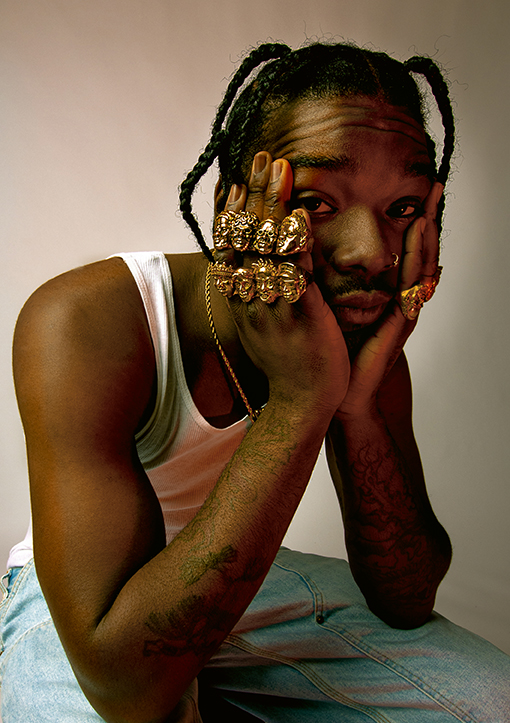 man wearing gold rings