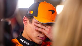 McLaren's Lando Norris with his face in his hands after the Qatar Grand Prix