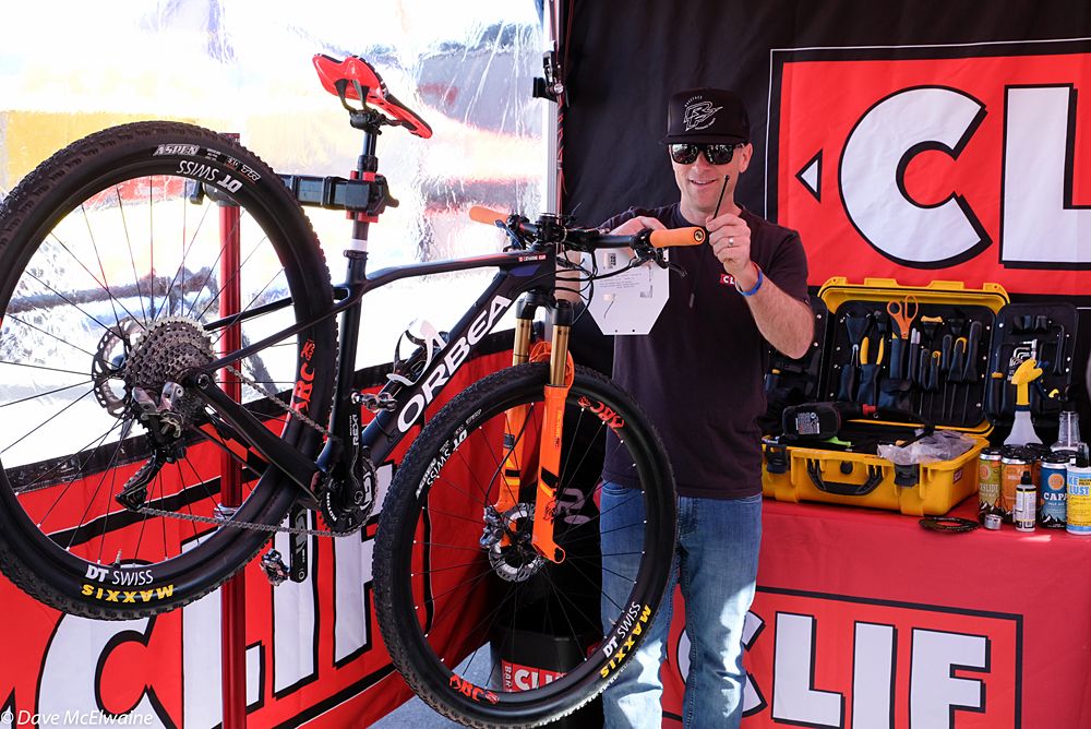 Chris Mathis, Clif Pro Team mechanic, readies the team bikes for the short track event.