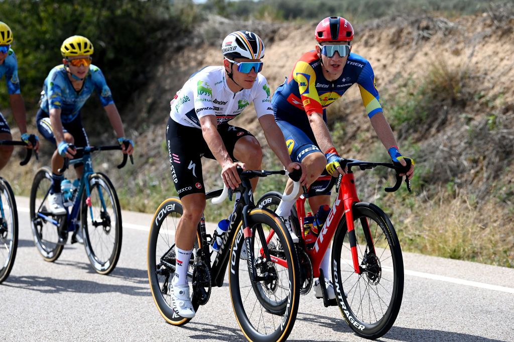 ZARAGOZA SPAIN SEPTEMBER 07 LR Remco Evenepoel of Belgium and Team Soudal Quick Step White best young jersey and Otto Vergaerde of Belgium and Team LidlTrek compete during the 78th Tour of Spain 2023 Stage 12 a 1506km from lvega to Zaragoza UCIWT on September 07 2023 in Zaragoza Spain Photo by Tim de WaeleGetty Images