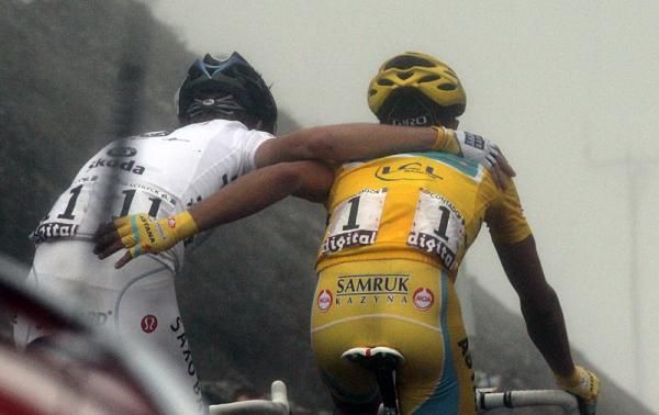 Andy Schleck and Alberto Contador embrace after riding to a stalemate on the Tourmalet.