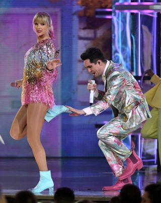 Taylor Swift and Brandon Urie performing at the 2019 Billboard Music Awards